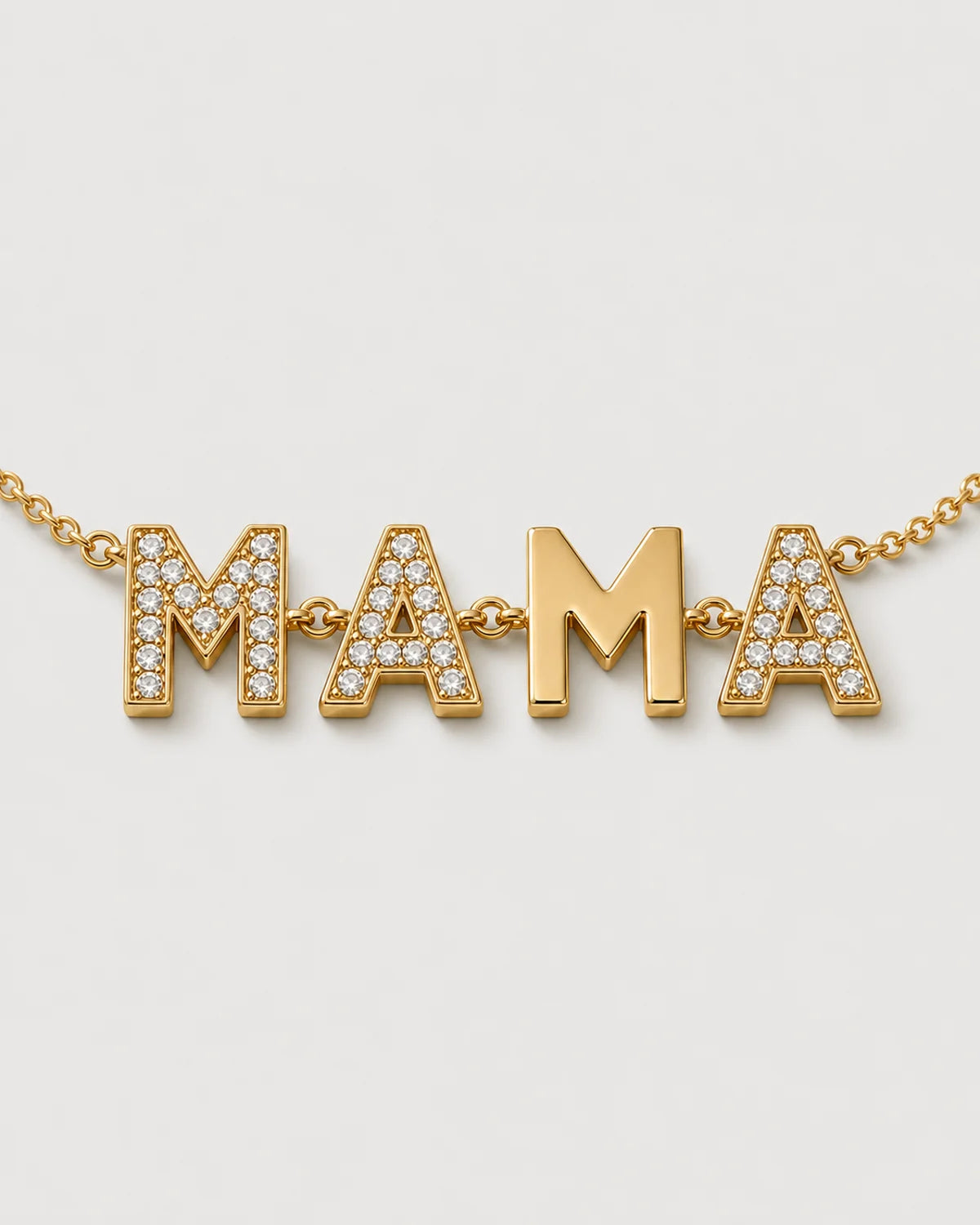 Macro of the Noa pavé and polished block-letter MAMA motif