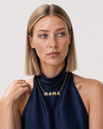 Alternate portrait of the same British model wearing the Noa MAMA necklace