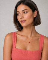 Alternate European-summer portrait featuring the Noemie crimson heart pendant
