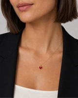 Close neckline view of the petite Noémie crimson heart and fine gold chain