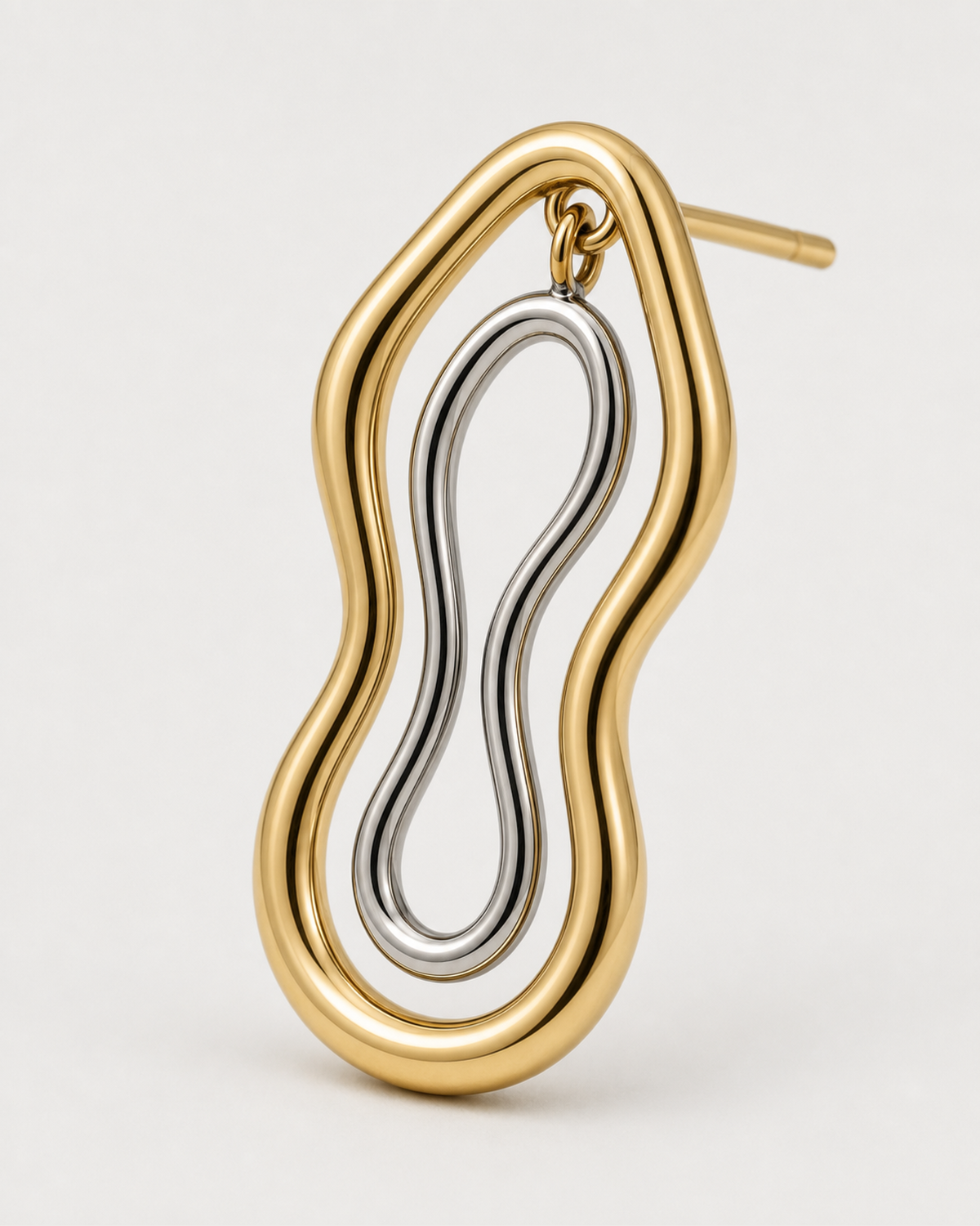 Macro of the Nysa gold open frame and suspended silver figure-eight insert