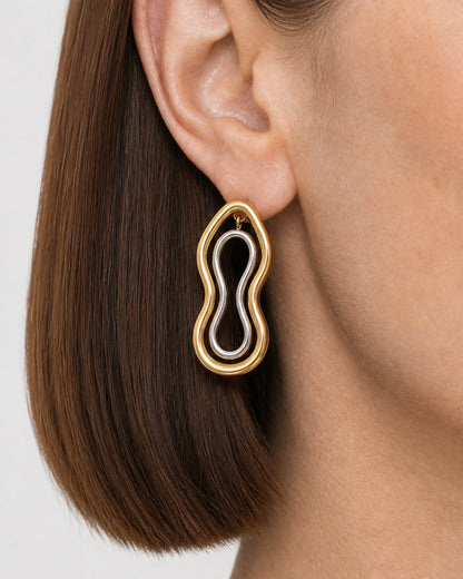 Extreme ear macro of the Nysa mixed-metal figure-eight stud and top connector