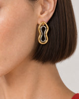 Extreme on-ear macro of the Nysa mixed-metal sculptural earring
