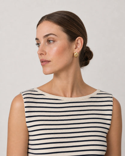 Alternate Riviera portrait featuring the Odette sculptural gold studs