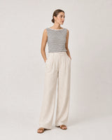 Wide studio portrait in Breton knit and ecru linen featuring Odette earrings