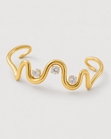 Macro of the Onda sculptural wave cuff and exactly three clear stones