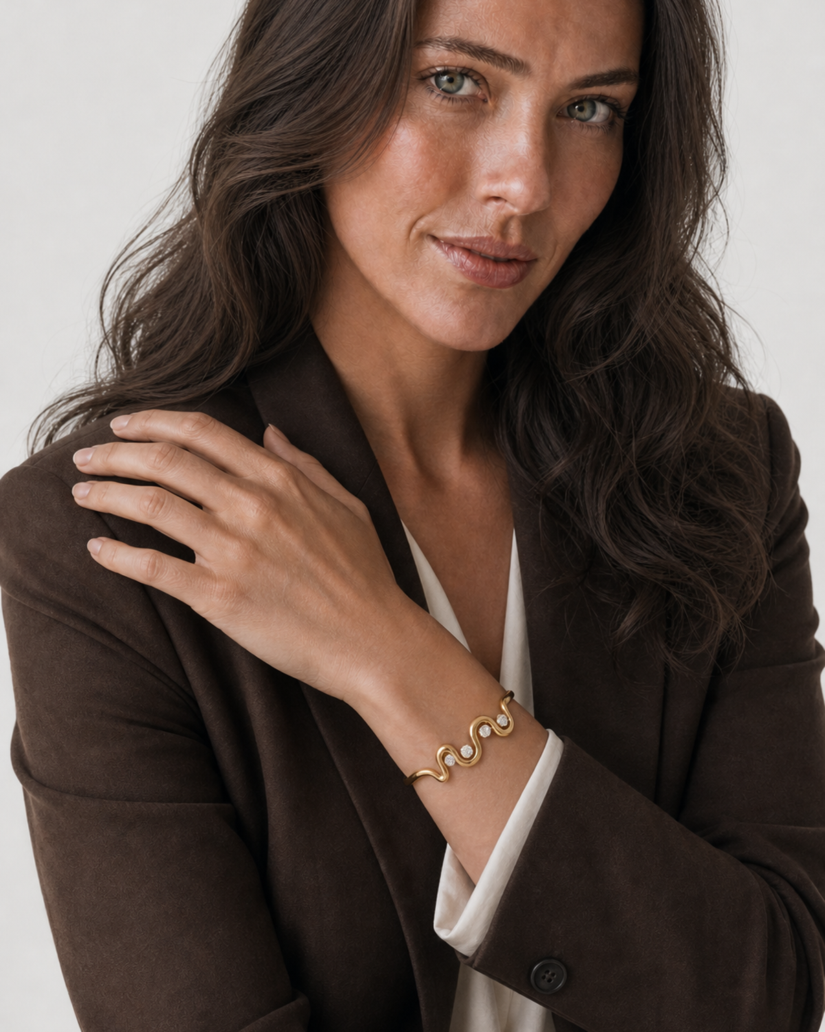 Alternate portrait of the same Australian model wearing the Onda wave cuff