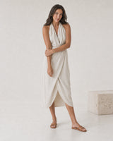 Full-body ivory linen summer portrait featuring the Onda crystal wave cuff