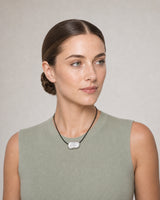 Alternate summer portrait featuring the Orra organic silver bean necklace
