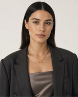 Australian model wearing the Romy T-bar necklace with a charcoal blazer