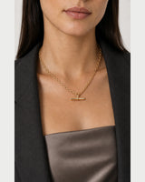 Clean neckline close-up showing the scale of the Romy necklace