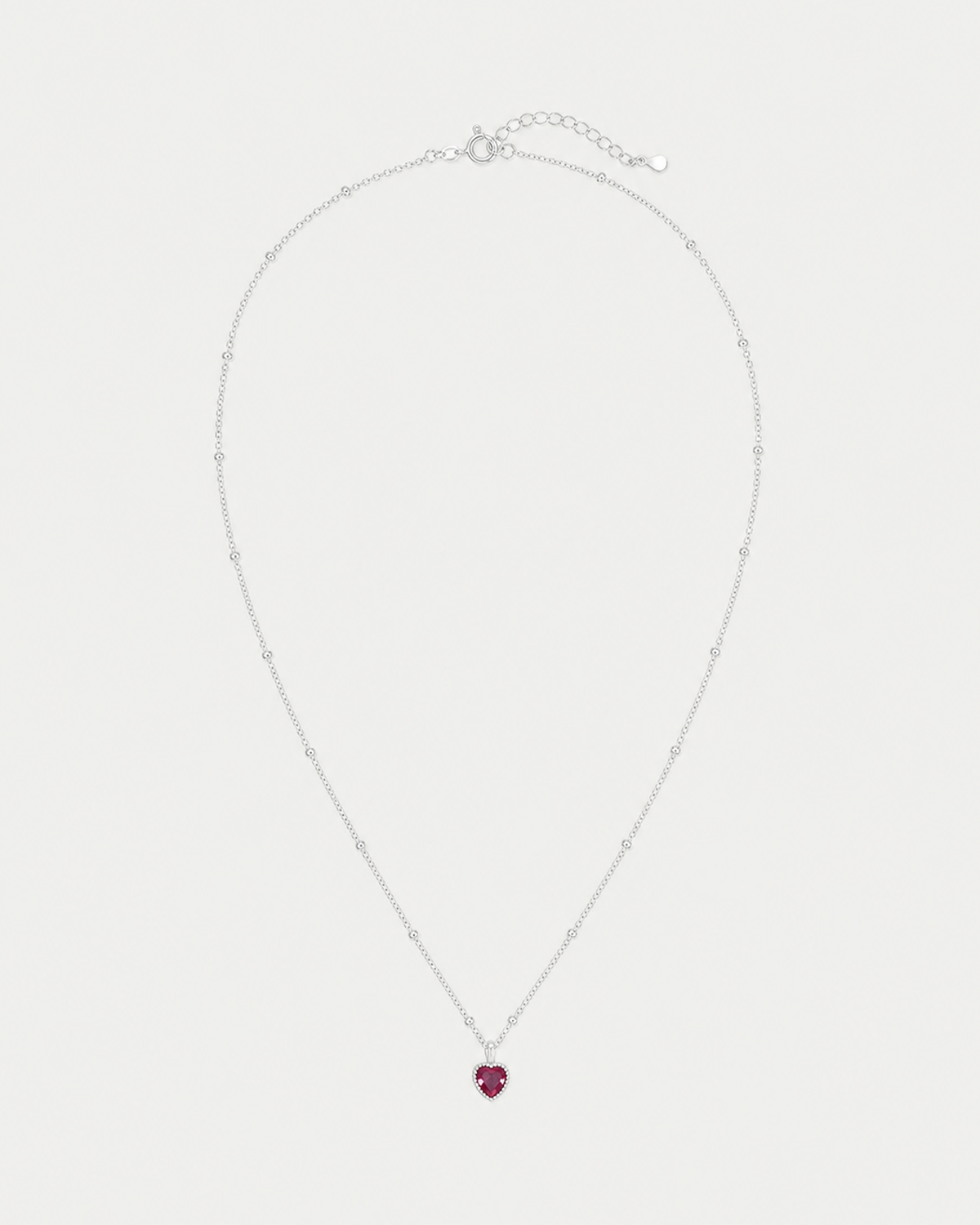 Rosalie silver beaded red heart necklace on pale dove-grey