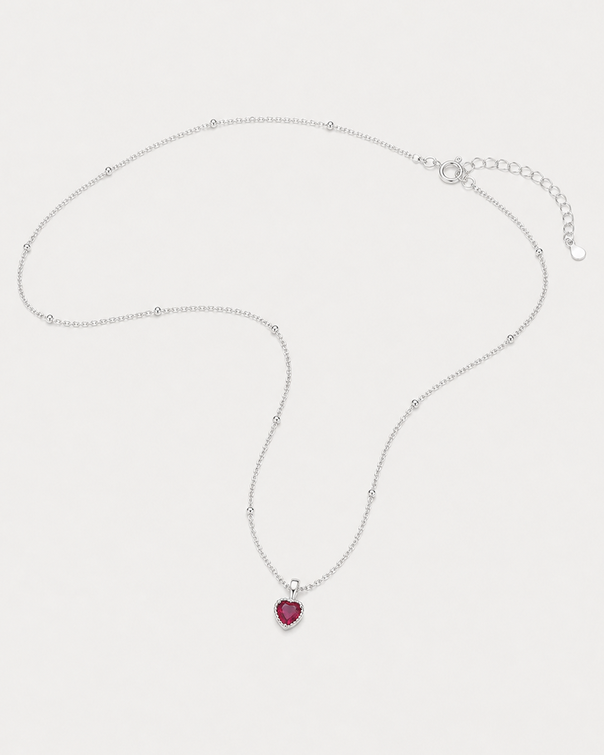 Rosalie red heart necklace in an alternate studio arrangement with clasp visible