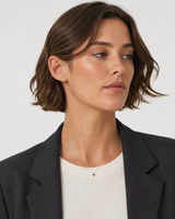 Australian model in charcoal tailoring wearing the Rosalie necklace