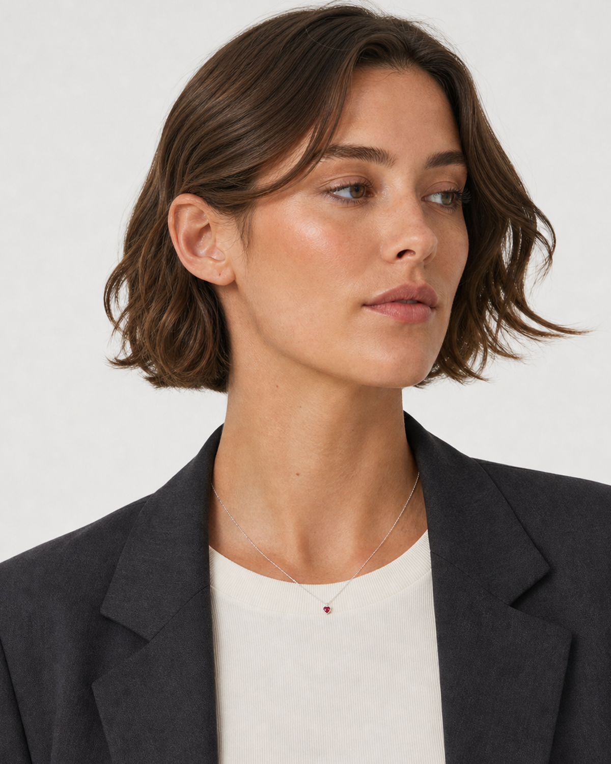 Australian model in charcoal tailoring wearing the Rosalie necklace