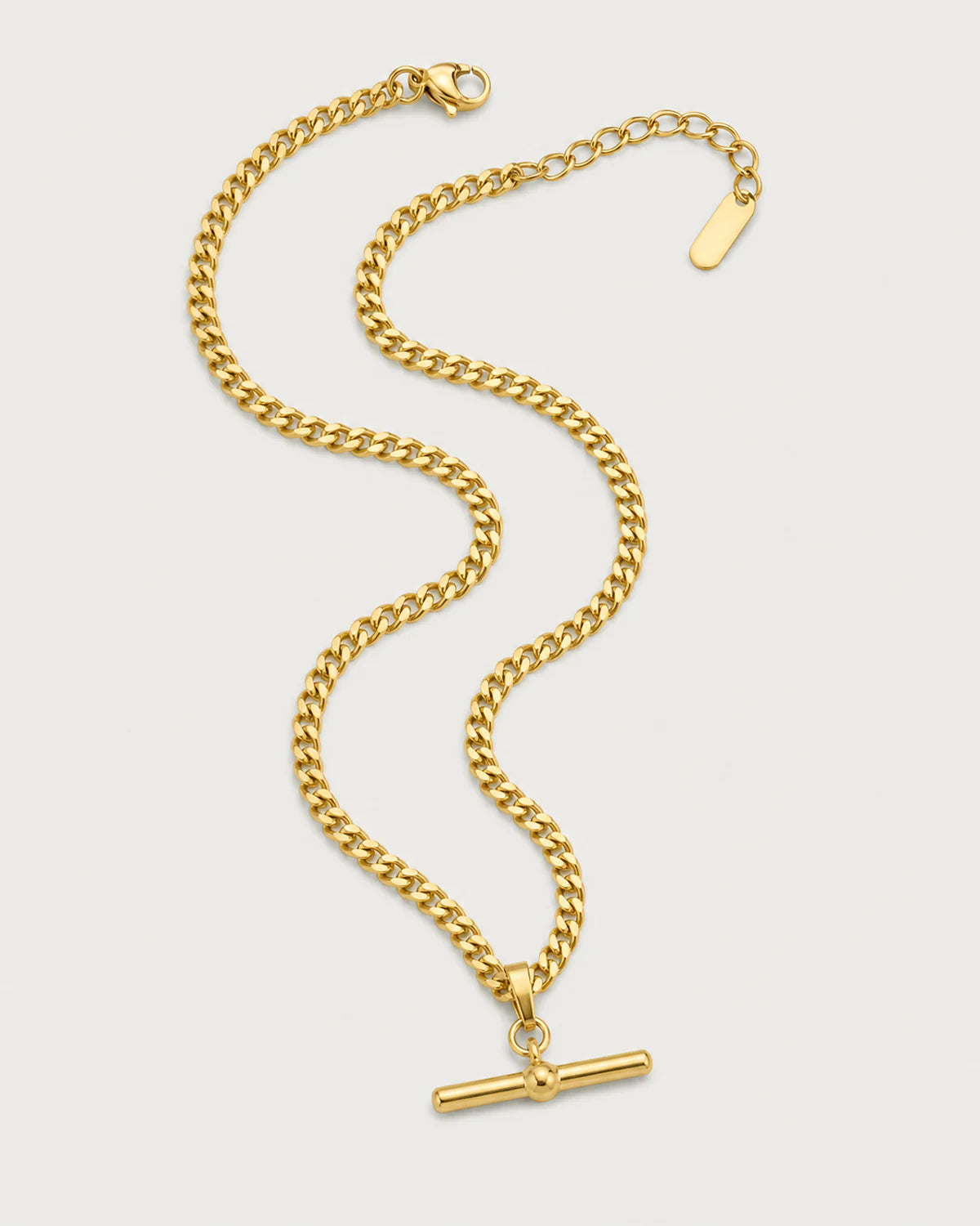 Sabine gold-tone curb T-bar necklace in an alternate arrangement on pale grey