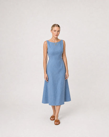 Full-body summer portrait in a blue linen midi dress featuring Sabine