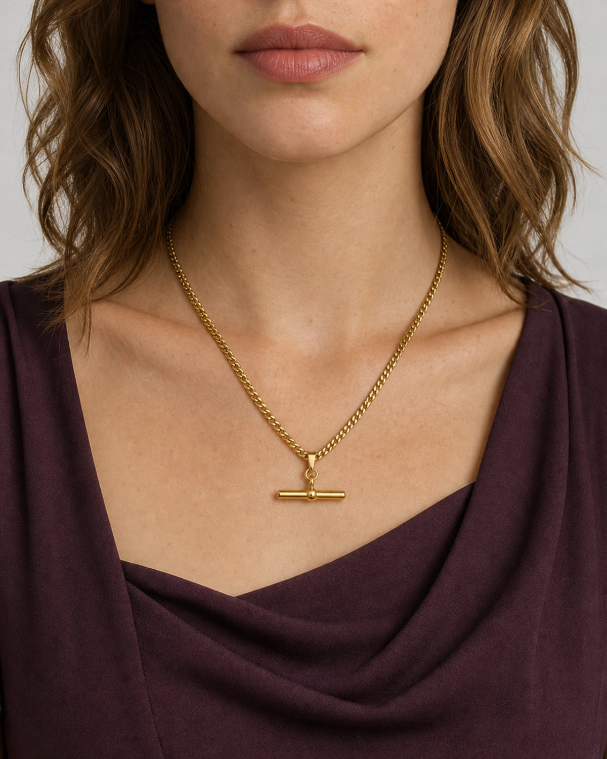 Eye-free front portrait of Evelyn wearing the Sabine curb T-bar necklace
