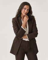Wide editorial studio portrait showing the Sera Mama bracelet at natural scale