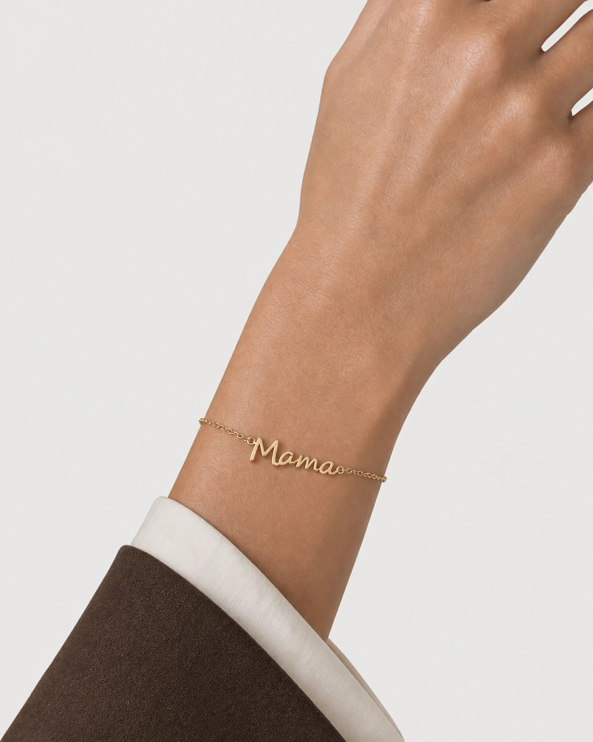 Clean wrist close-up of the polished Sera Script Mama Bracelet