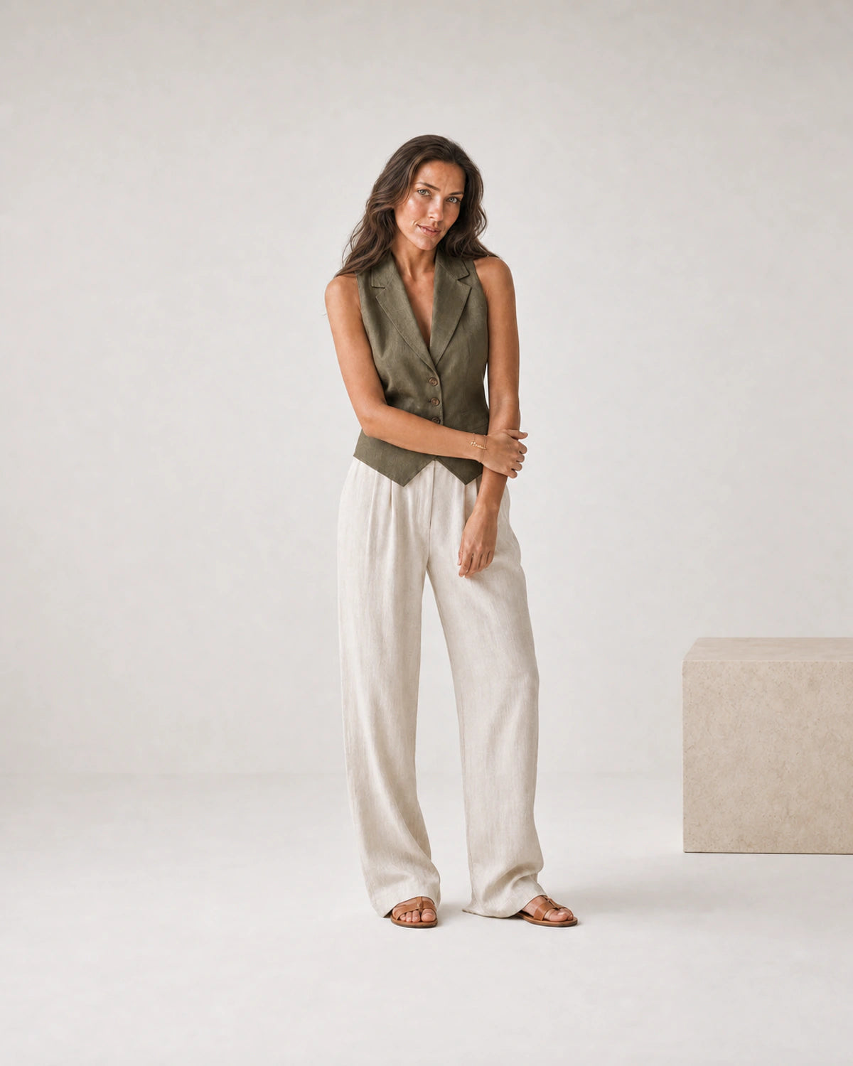 Full-body olive and cream linen portrait featuring the Sera Mama bracelet