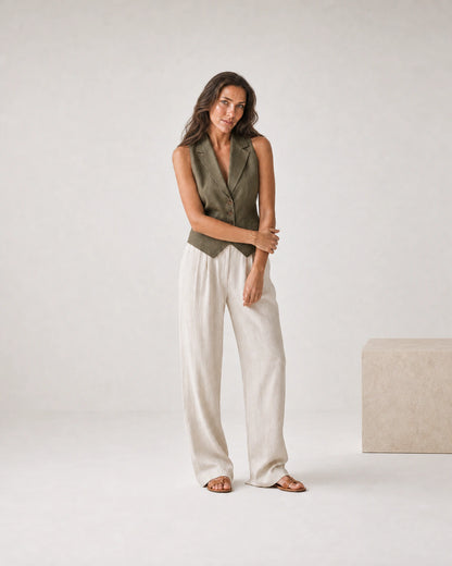 Full-body olive and cream linen portrait featuring the Sera Mama bracelet