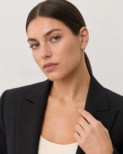 Grey-studio portrait featuring Serein pave huggies