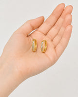 Hand-held scale view of the Serein pave huggie pair