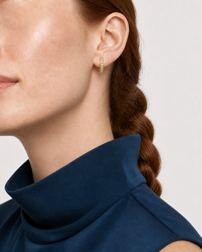 Alternate left-ear and lower-face view of the Serein gold pavé huggie