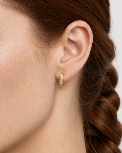 Complete Serein gold pavé huggie worn in an extreme ear macro