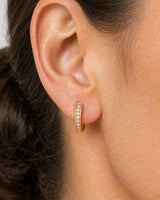 Extreme on-ear macro of the Serein pave row, hoop curve and hinge