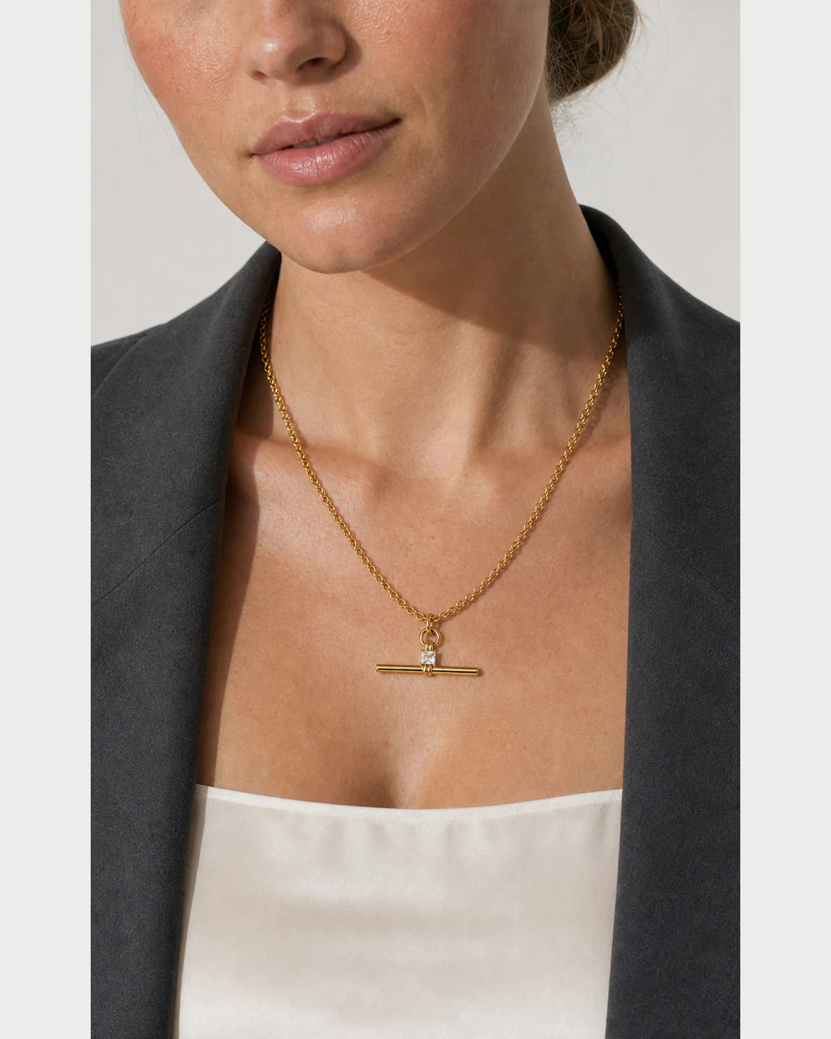Clean neckline close-up showing the human scale of the Sloane necklace