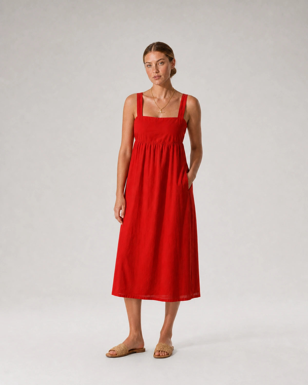 Full-body red sundress portrait featuring the Sloane crystal toggle necklace