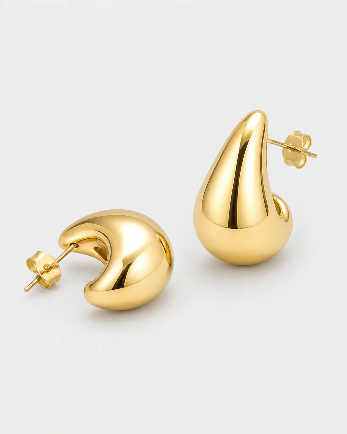 Solène gold teardrop studs in an alternate studio arrangement