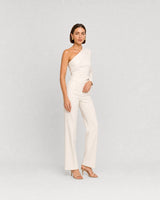 Full-body ivory one-shoulder summer portrait featuring Solène gold teardrop studs