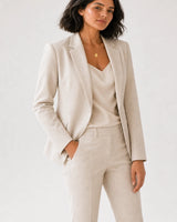 Wide editorial studio portrait showing the Solenne pendant necklace at natural scale