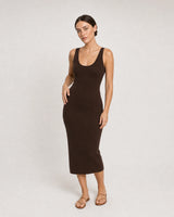 Full-body espresso knit dress portrait featuring the Solenne pendant necklace
