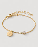Alternate gold Soline bracelet view with clasp and extender on neutral grey