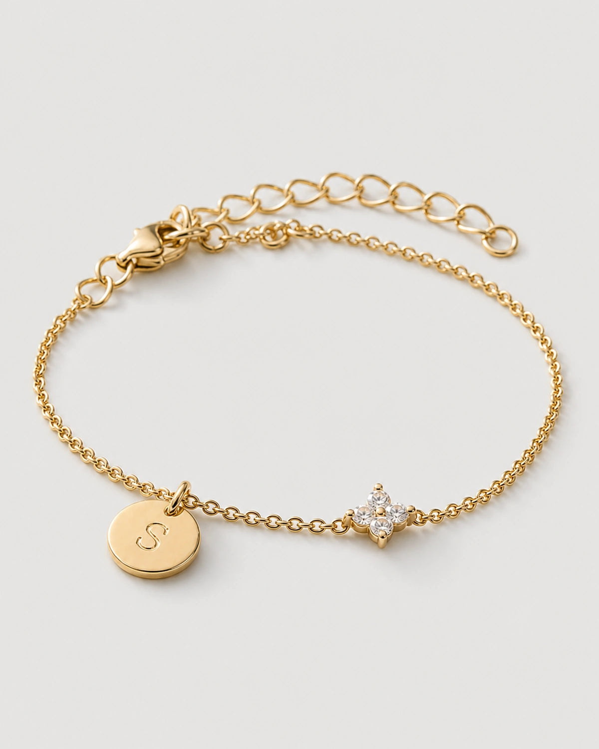 Alternate gold Soline bracelet view with clasp and extender on neutral grey