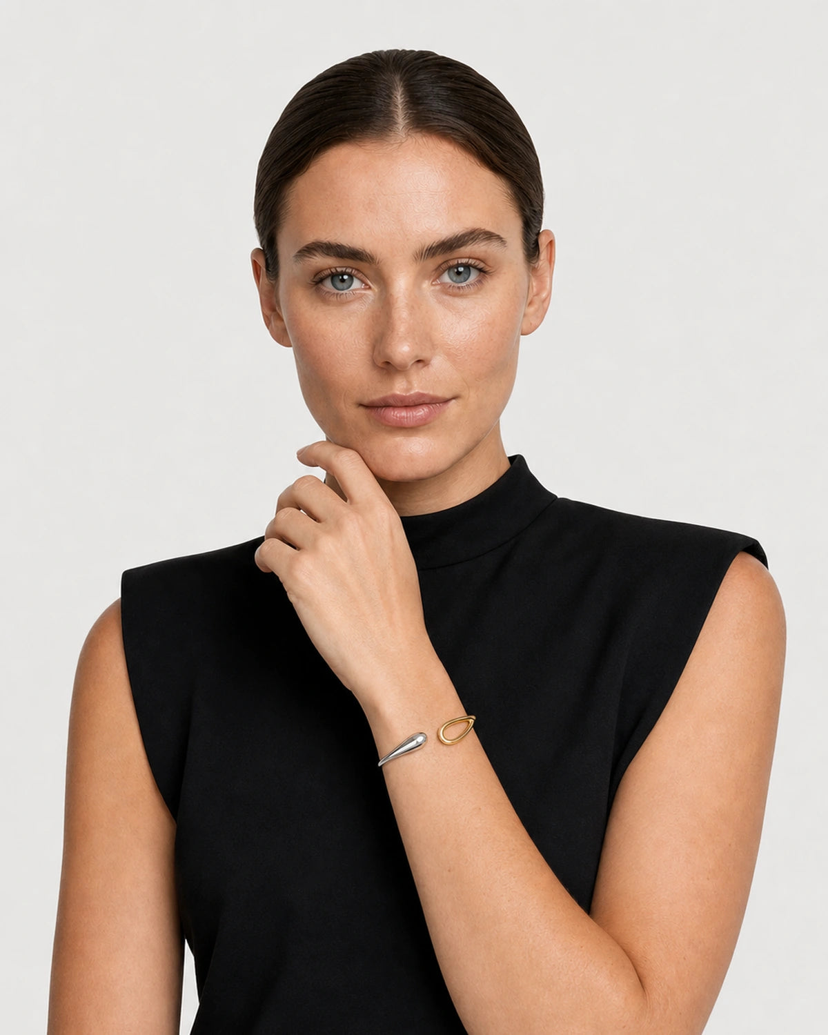 Human-scale portrait showing the Sora two-tone bangle