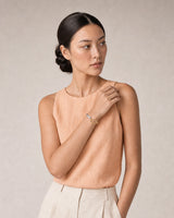 Alternate summer portrait featuring the Sora silver and gold open cuff
