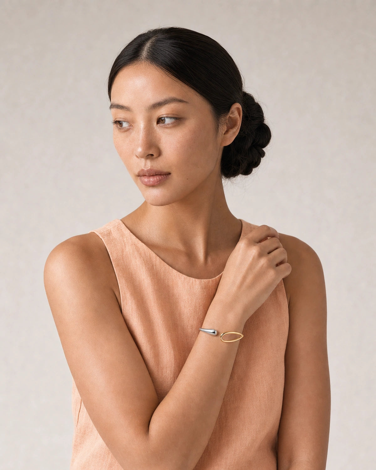 Human-scale summer portrait showing the Sora two-tone open cuff