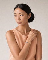 Human-scale summer portrait showing the Sora two-tone open cuff