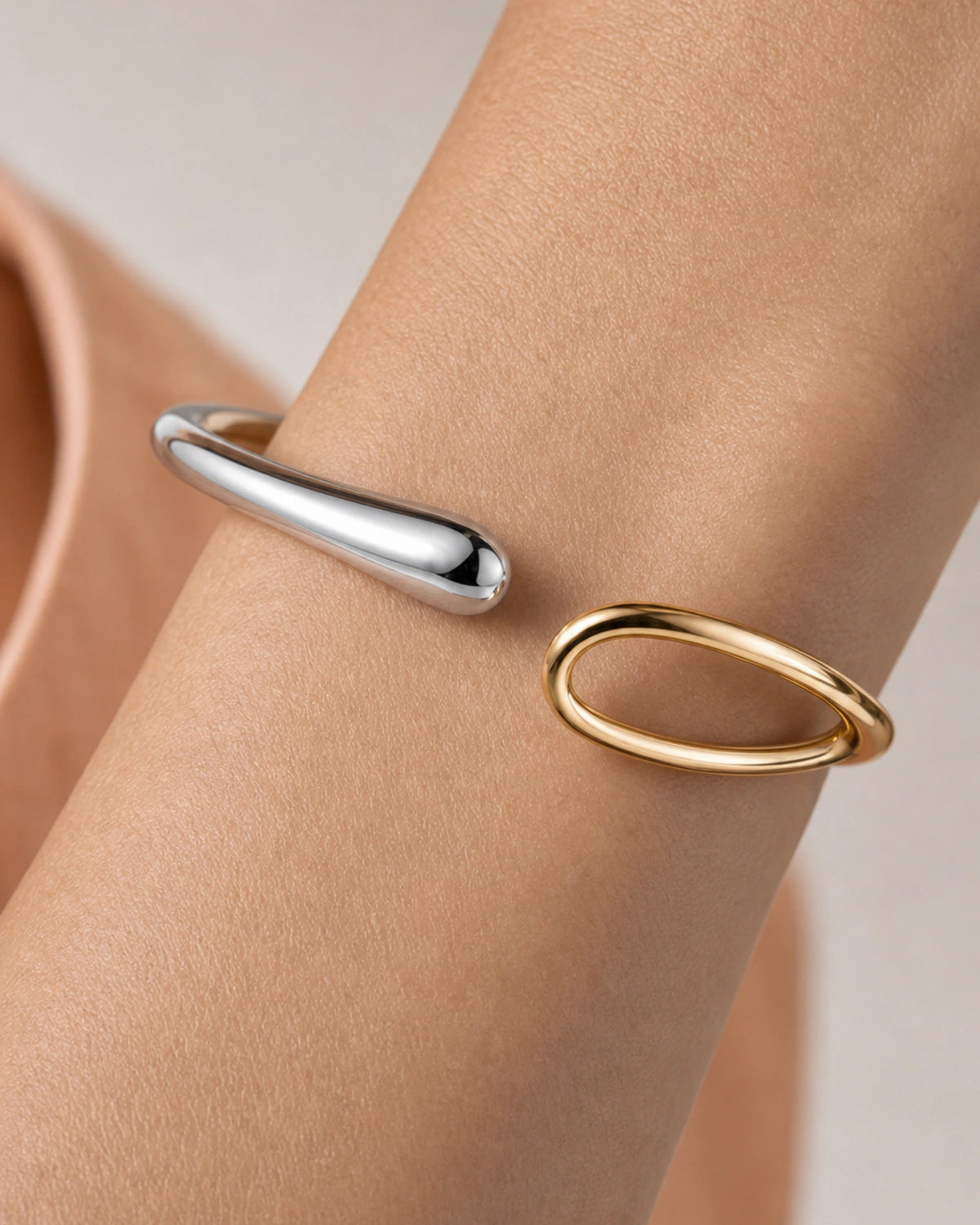 Extreme wrist macro of the Sora silver droplet and hollow gold loop