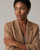 Three-quarter model portrait wearing Talia with a pensive side gaze