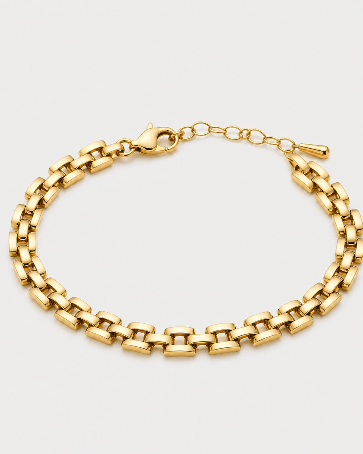 Talia gold timepiece link bracelet on warm soft ivory