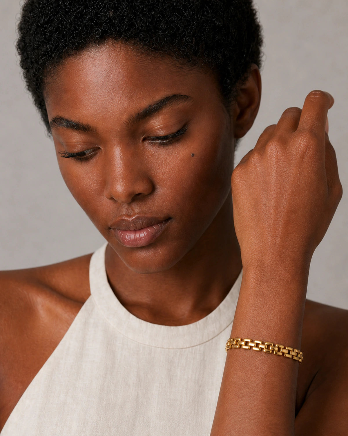 Close wearing view of the polished Talia gold articulated watch links