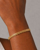 Extreme on-wrist macro of the slim Talia gold articulated link construction