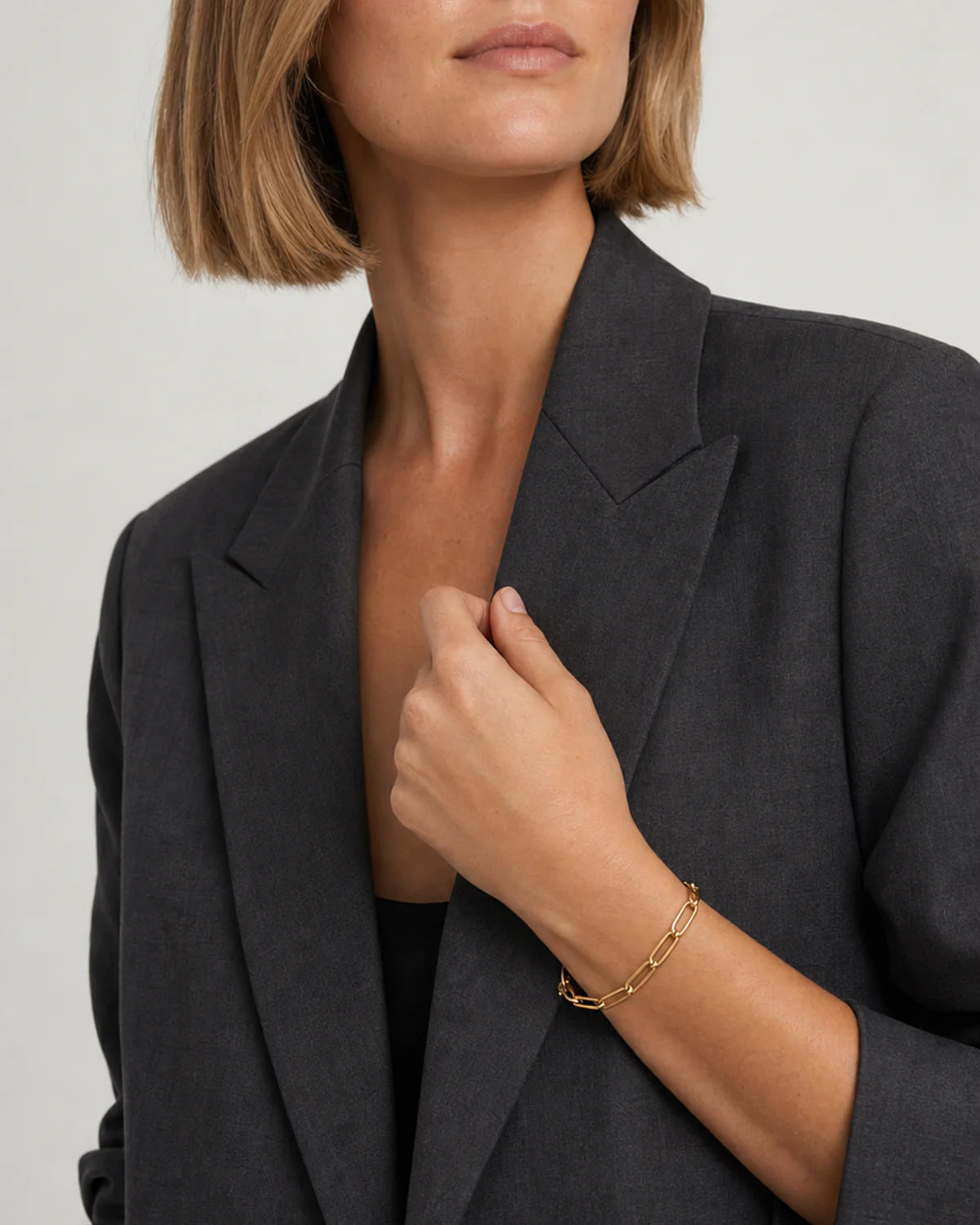 Australian model in charcoal tailoring wearing Vela bracelet
