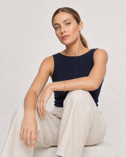 Human-scale Riviera summer portrait showing the Vela paperclip bracelet